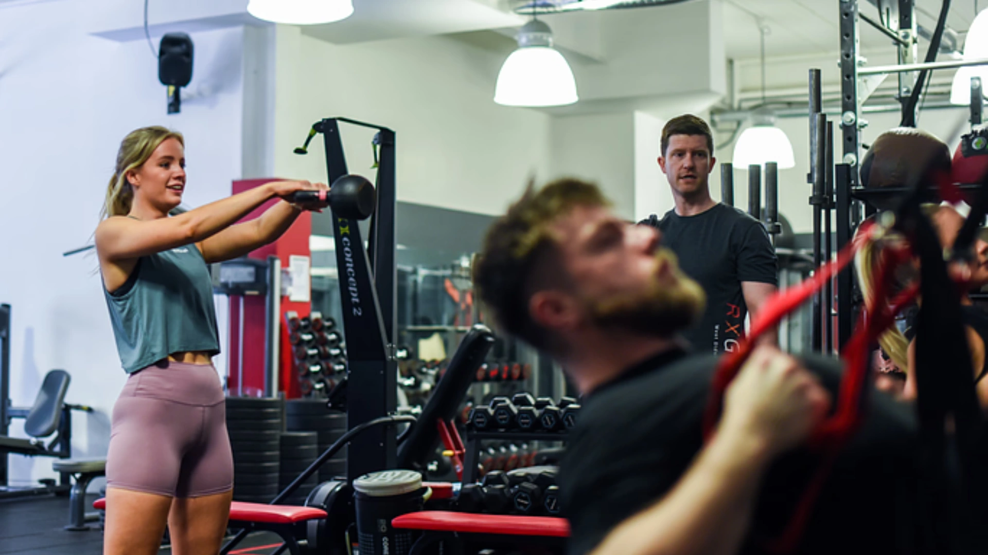 one girl with kettlebell and two mans training