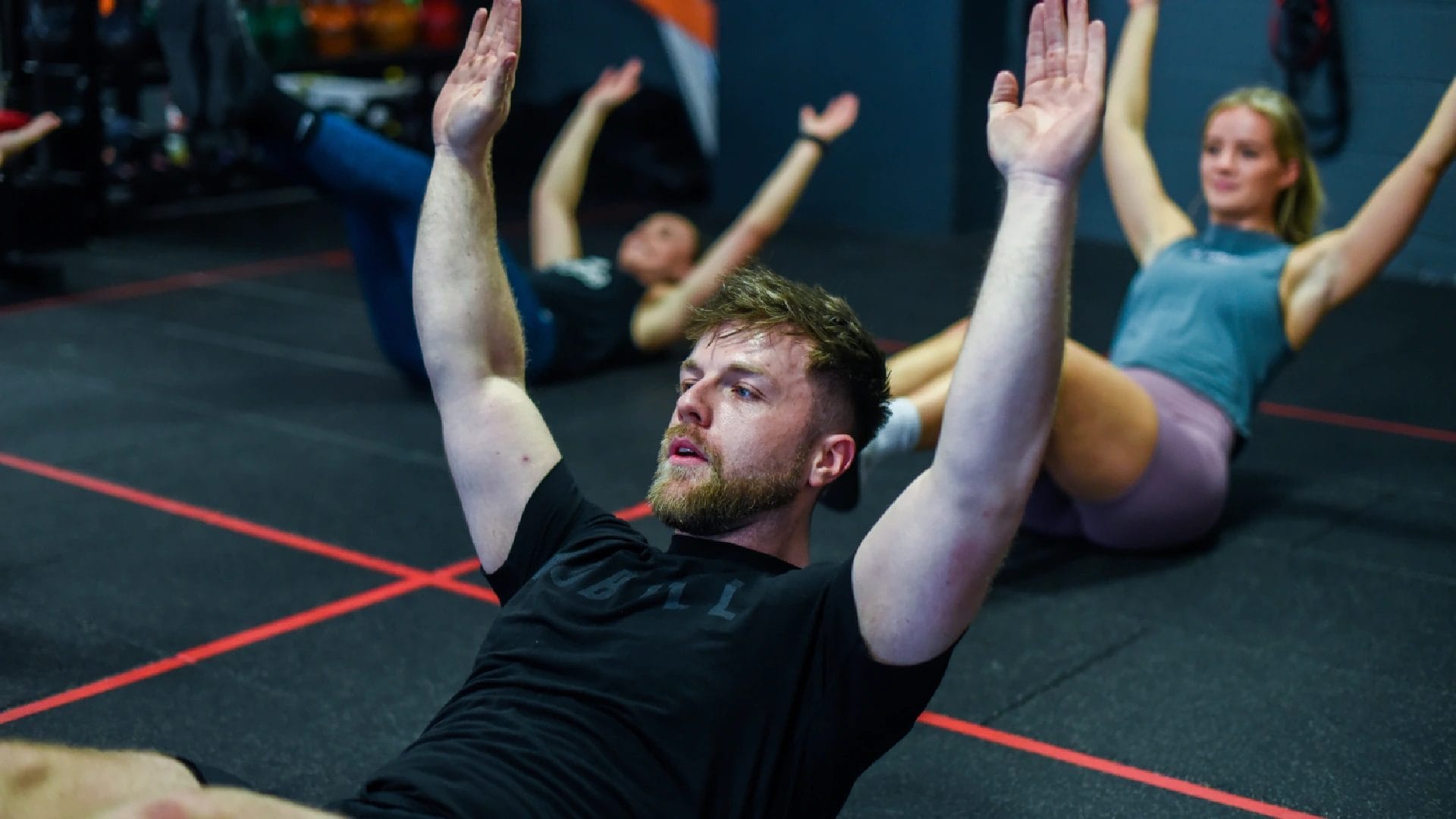 man and woman do yoga