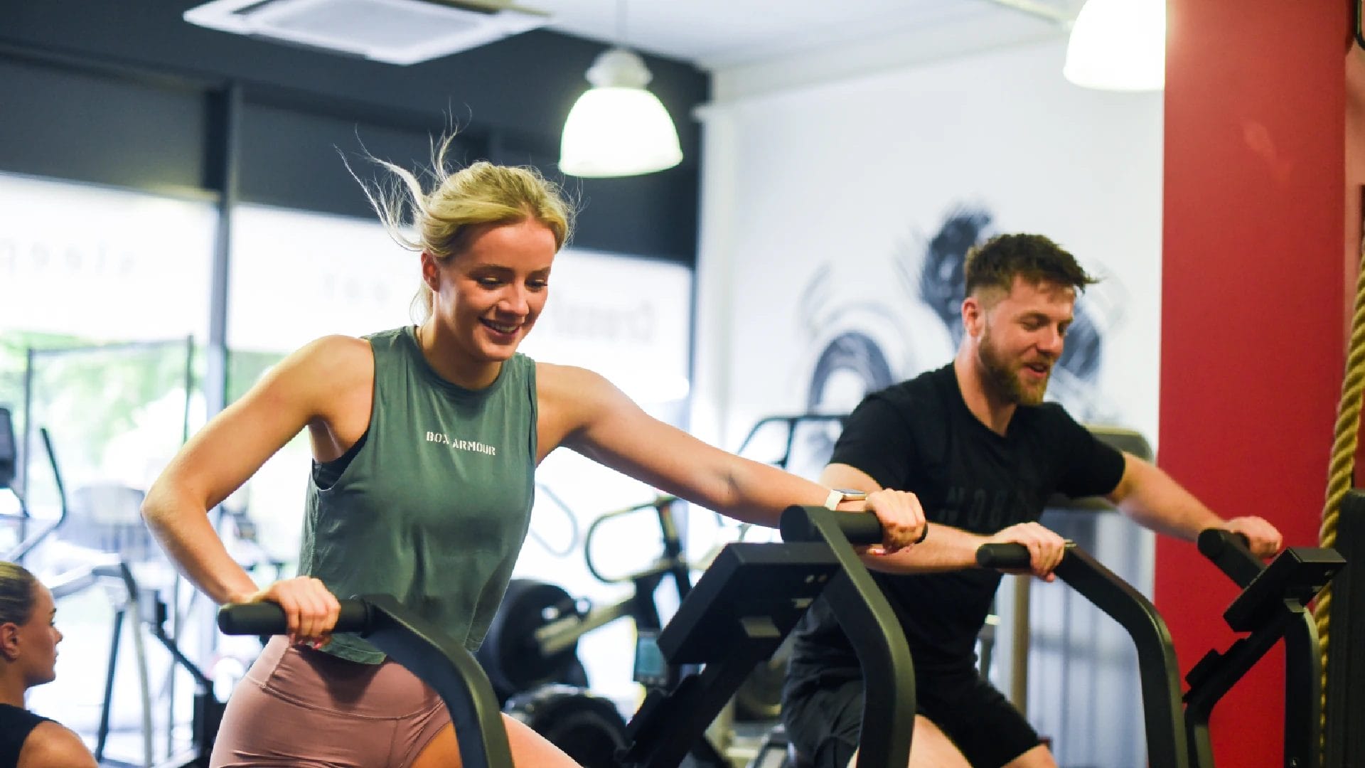 man and woman do cardio training