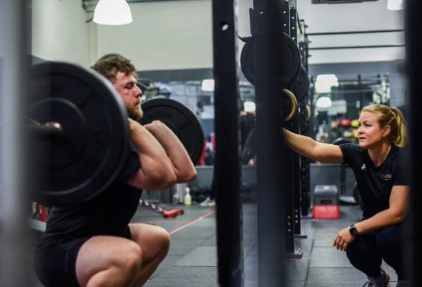 man lift heights with girl next to him